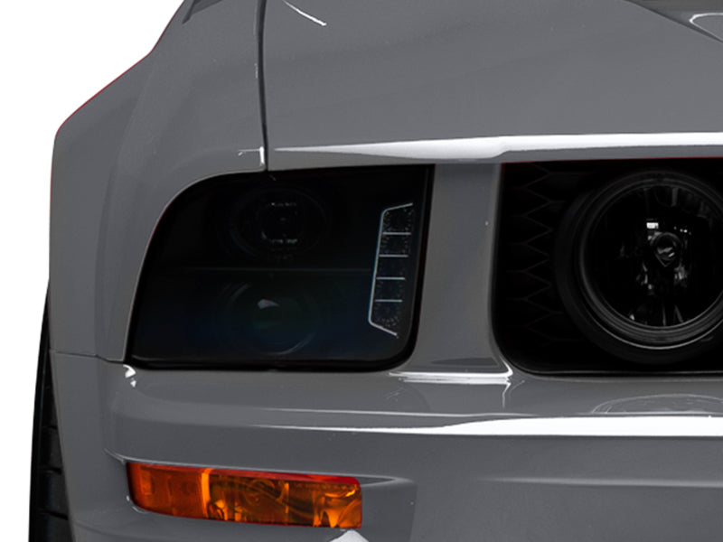 Raxiom 05-09 Ford Mustang w/ Halogen LED Halo Prjctr Headlights-Blk - 49128