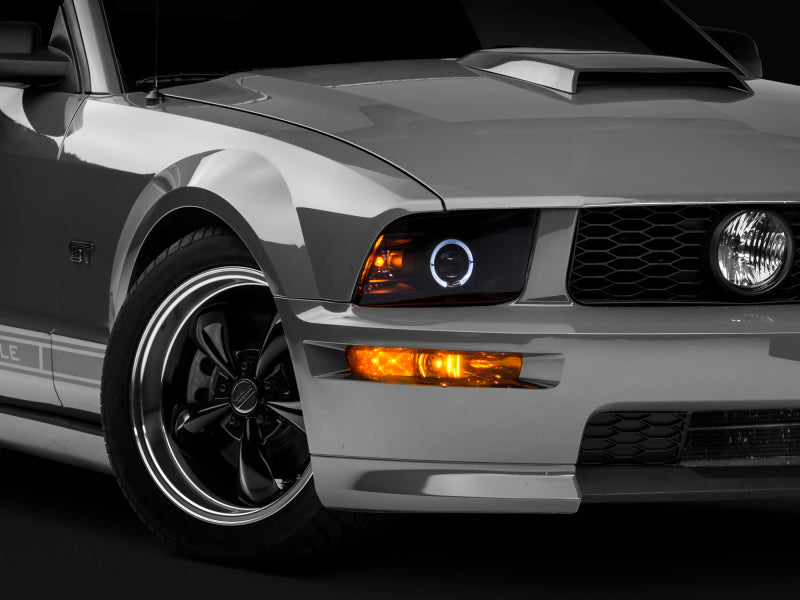 Raxiom 05-09 Ford Mustang Halogen 2010 Style LED Halo Headlights-Blk - 101682